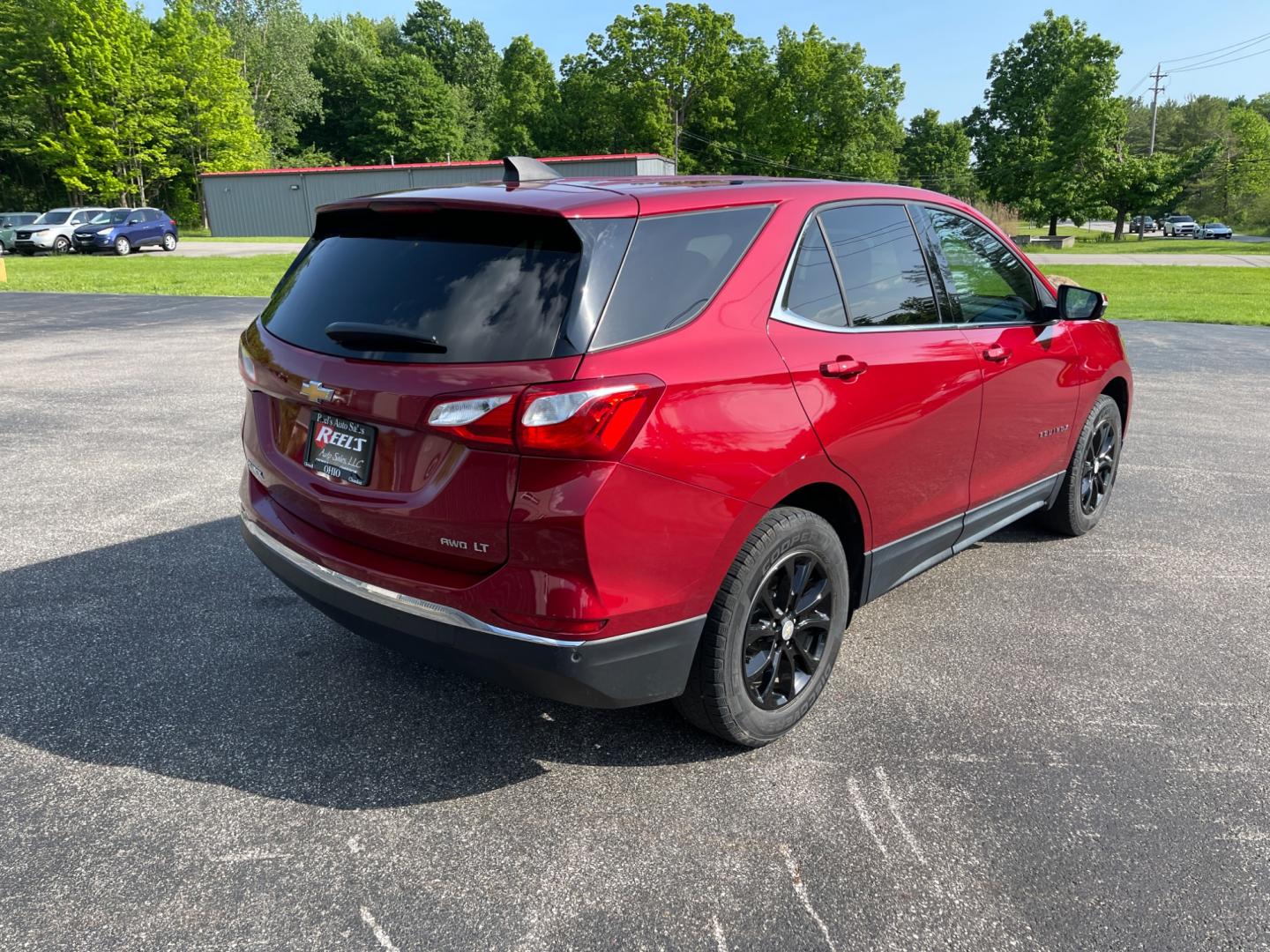 2018 Red /Black Chevrolet Equinox LT AWD (2GNAXSEV2J6) with an 1.5L I4 DOHC 16V TURBO engine, 6-Speed Automatic transmission, located at 11115 Chardon Rd. , Chardon, OH, 44024, (440) 214-9705, 41.580246, -81.241943 - This 2018 Chevrolet Equinox LT AWD with a 1.5L EcoTec Turbocharged engine and 6-speed automatic transmission offers a balanced blend of performance and fuel efficiency with a 30 MPG highway rating. This compact SUV is well-equipped for safety and convenience, featuring blind spot monitoring, rear cr - Photo#7